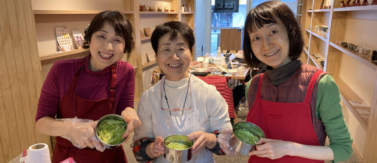 Photo of three ladies smiling with vegetable cakes.